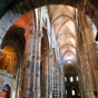 L'intérieur de l'église se caractérise par une belle polychromie de pierres grises, rouges, blanches et noires qui proviennent de carrières voisines : le grès rouge vient d'Allevier (Azérat), le grès calcaire de Beaumont, le basalte de La Vergueur (Saint-Just-près-Brioude) et le marbre de Lauriat (Enval). Ils s'harmonisent avec le pavement, en galets de l'Allier noirs et blancs, aux motifs géométriques d'arabesques.